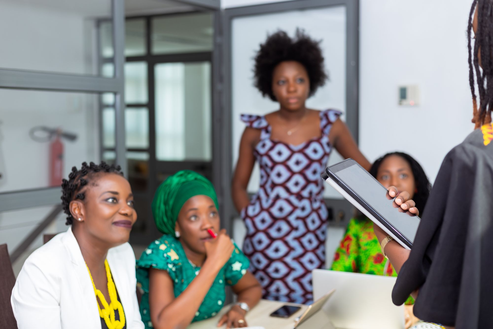 African colleagues discussing work together in an office